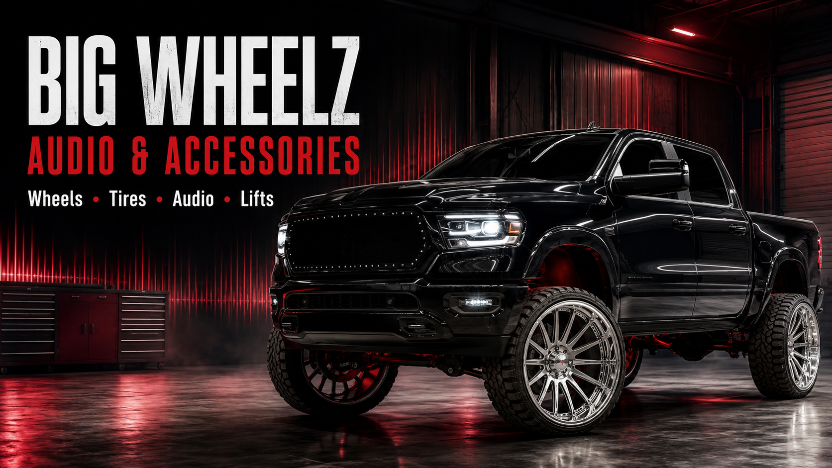 Black lifted pickup with polished custom wheels in a professional installation bay